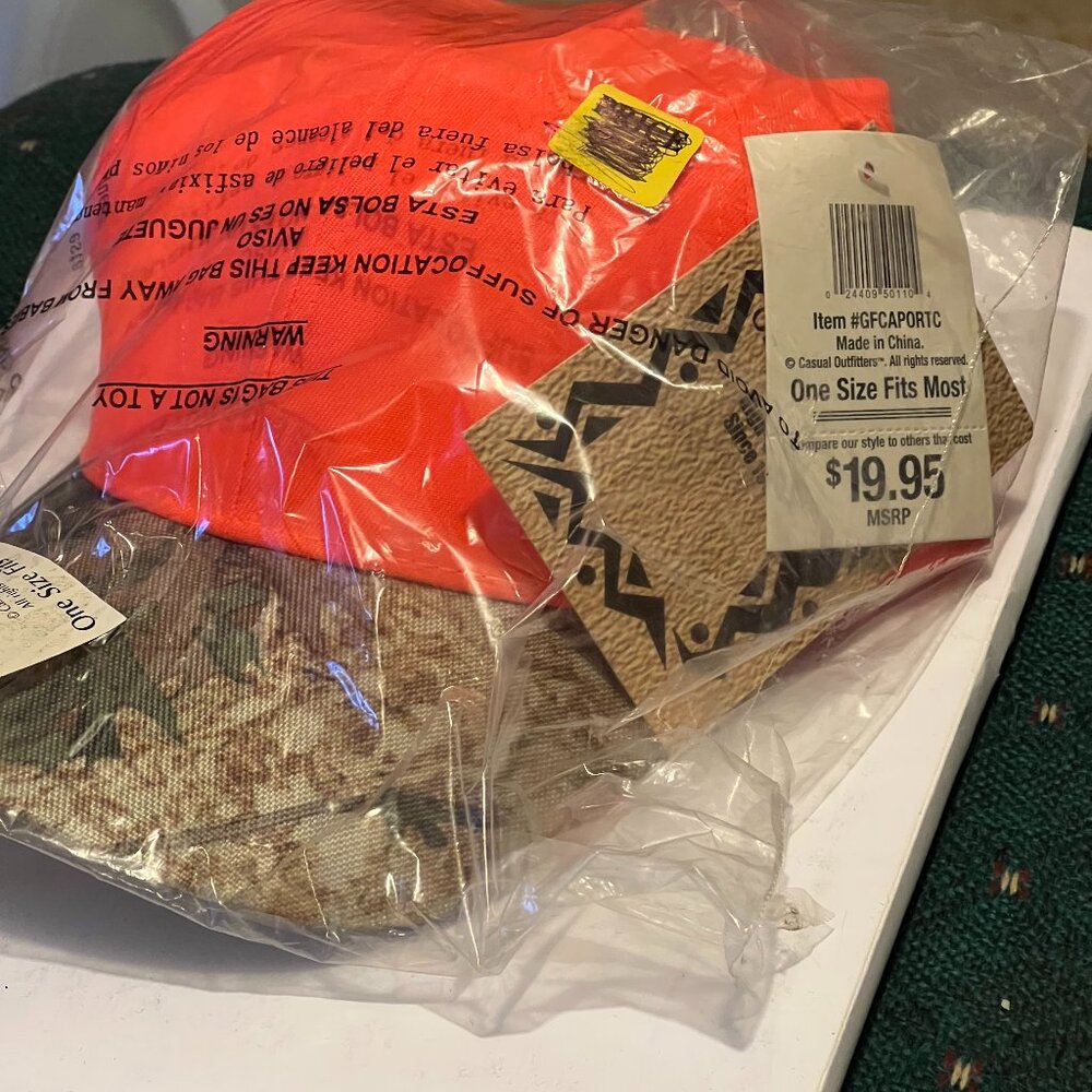 Casual outfitters orange and brown cam cap.